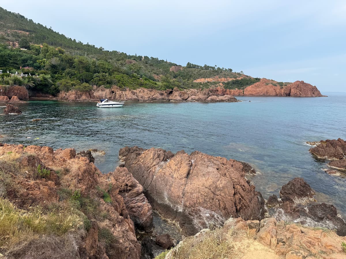 Red rocks and clear water in a cove of the Esterel